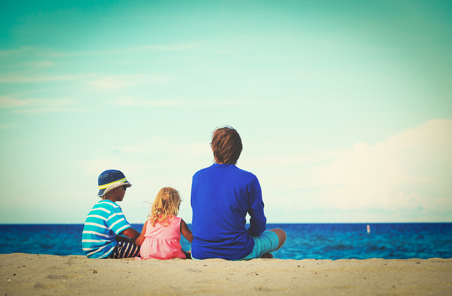 father with little son and daughter on beach, family at beach