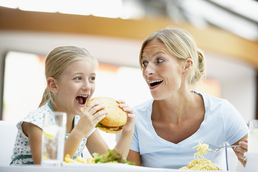 Mother And Daughter Having Lunch Together At The Mall